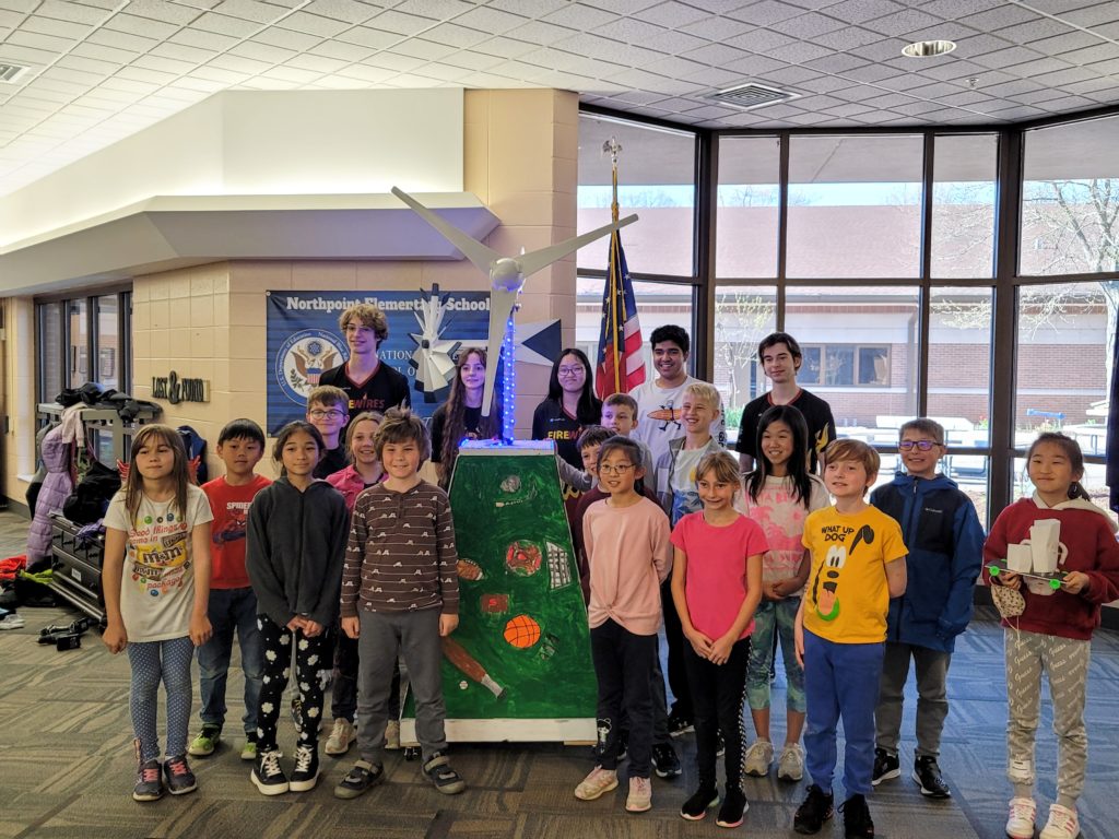 Northpoint Elementary Students pose proudly by the windmill they helped to build.