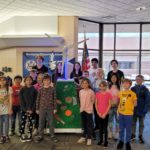 Northpoint Elementary Students pose proudly by the windmill they helped to build.